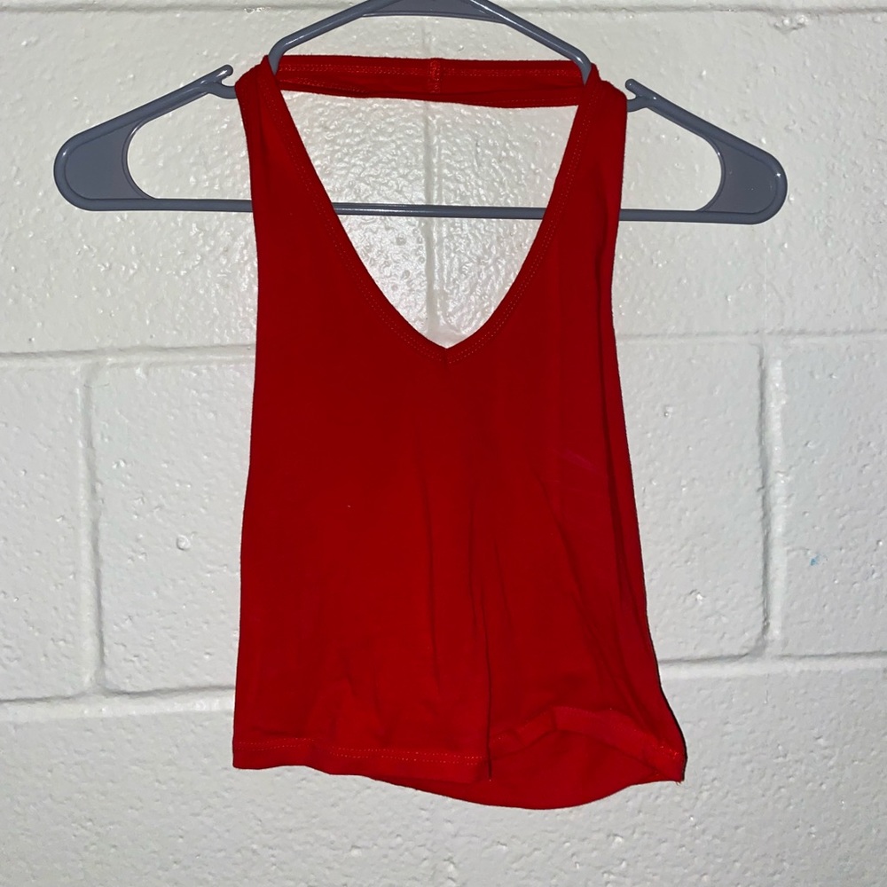 Sleeveless tank top (goes around neck and open back)